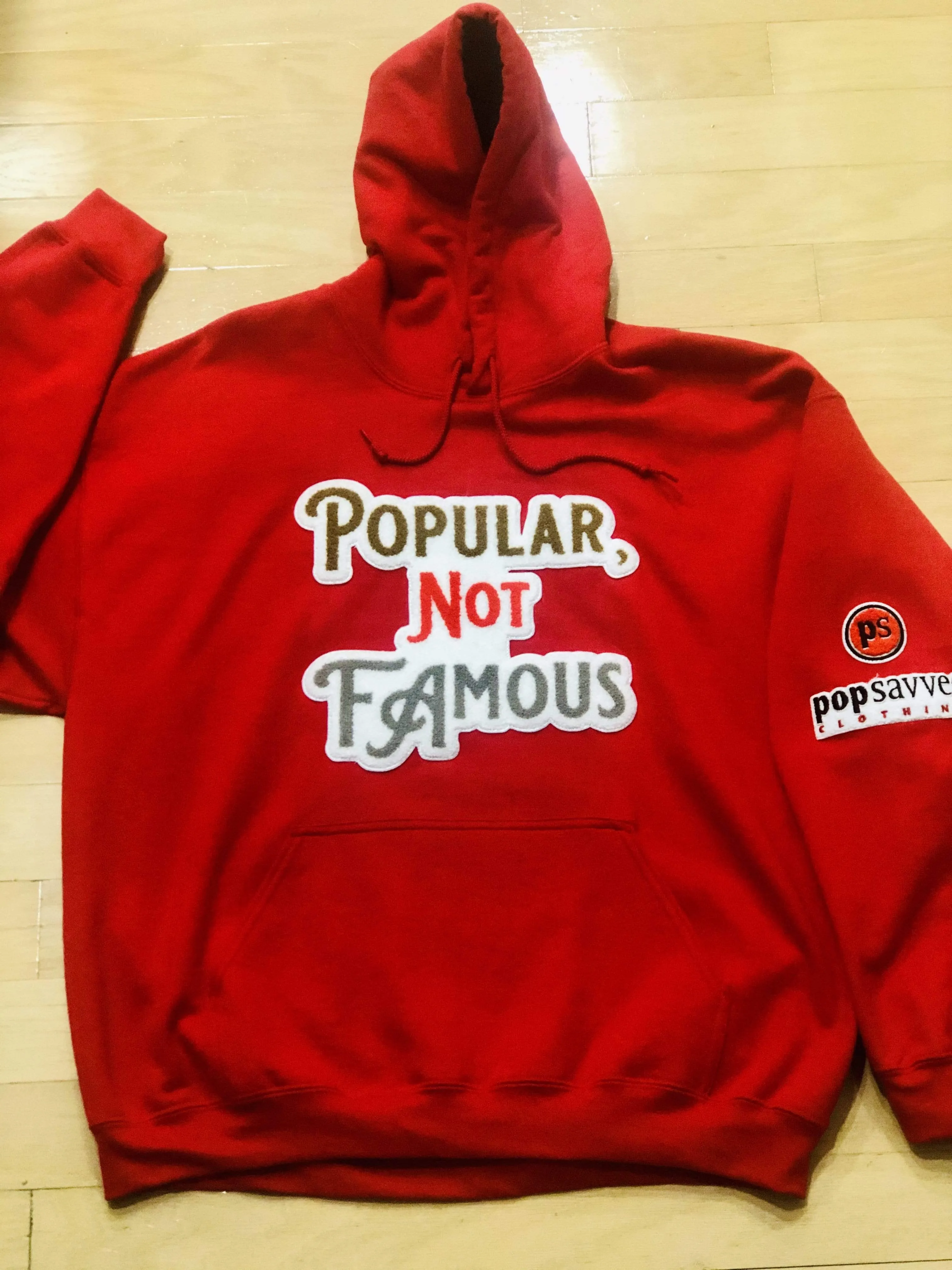 Red Pullover Style Hoodie w/ Chenille Embroidered “Popular Not Famous” Logo